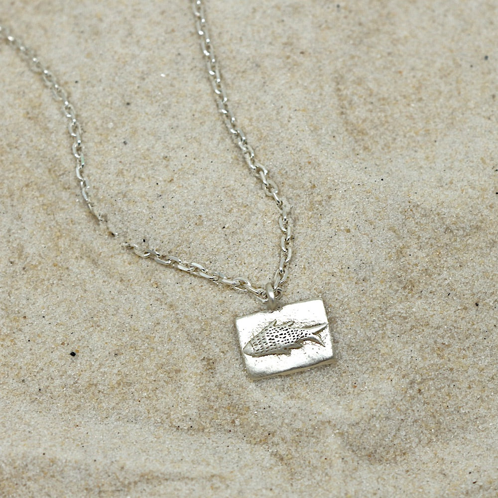 Enki's Shadow charm on chain